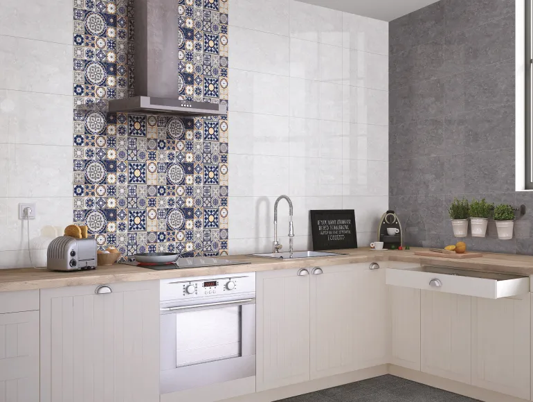 Sleek white kitchen design featuring mosaic tile backsplash